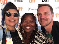 three people posing for a selfie at the toronto international film festival